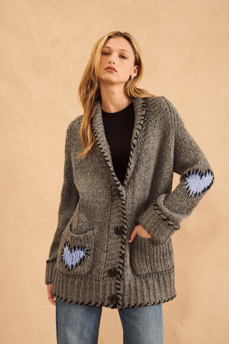 grey Shawl collar cardigan with whipstitch detail and Blue hearts on the elbow 