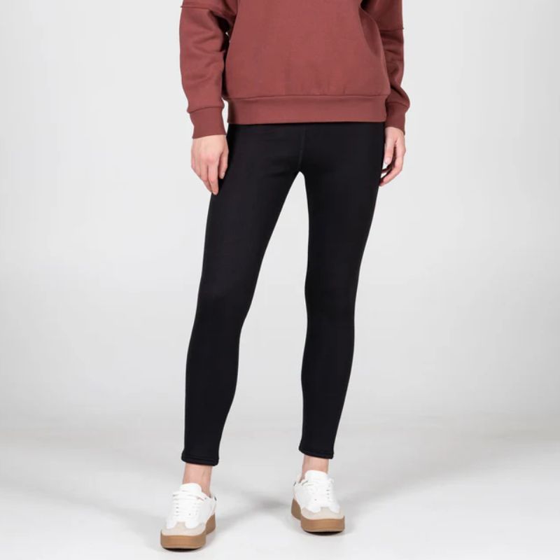 black legging pants on a white background with a charcoal grey sherpa lining 