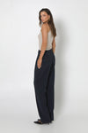 The Wynter pant in Navy has a relaxed fit through the leg, side slit pockets and a high waist.
