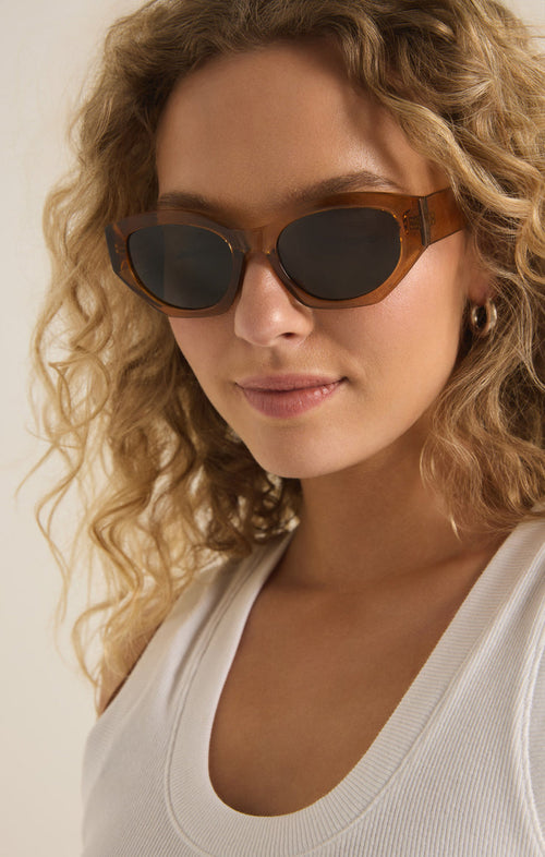 Model wearing LOVESICK sunglasses in a light coloured warmsands frame by Z SUPPLY 