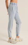 A slim fit Jogger Pant in washed denim  with side seam pockets - side view 