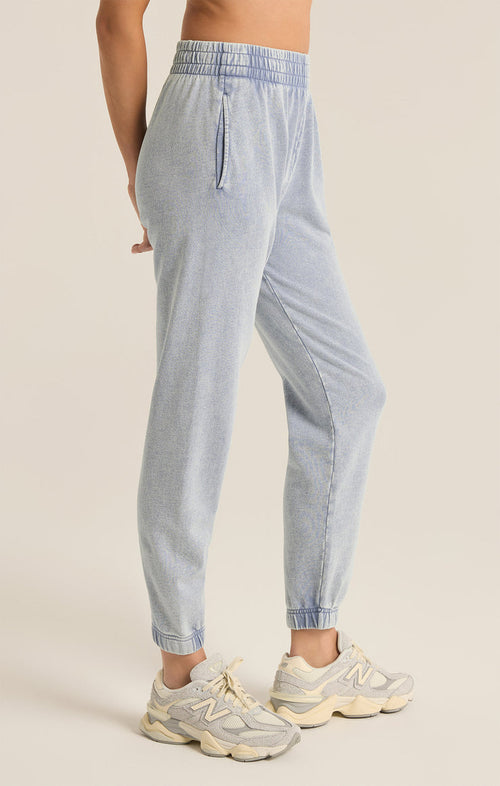A slim fit Jogger Pant in washed denim  with side seam pockets - side view 
