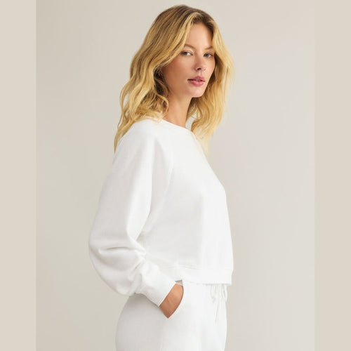 Reset sweatshirt in white cotton side view -shows length where it hits at the waist, 