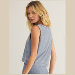 Back view of a bra friendly,  relaxed V neck sleeveless top -n medium indigo blue .