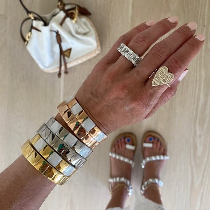 Model wearing a stack of Square Aura Bracelets 