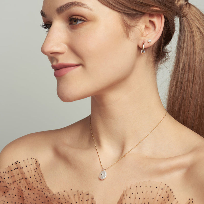 Poppy Finch Petal Pearl Pendant Necklace on model