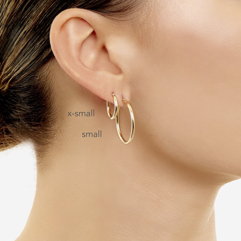 2mm Gold Tube Hoops model wearing X small on top and a small on bottom. 