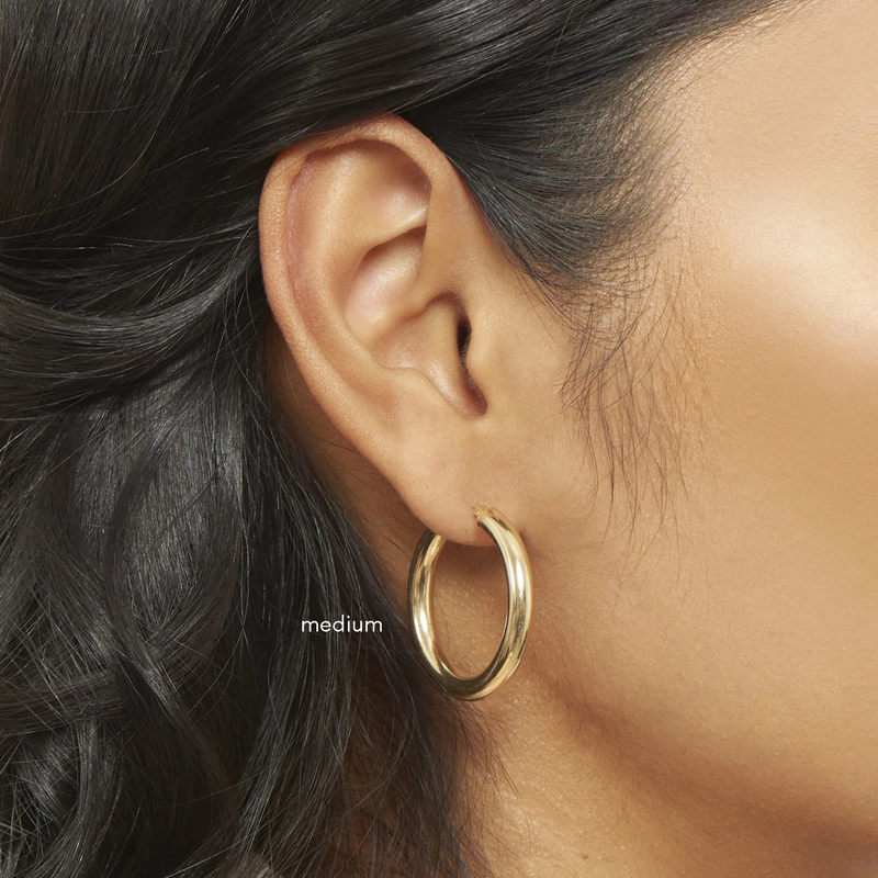 Model wearing 4mm gold tube hoops - medium 