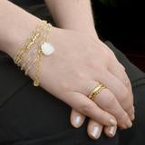 Gold bracelet  with a small Trillion Moonstone Charm 