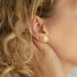 Hammered Concave Gold Disc Earrings on model- yellow gold 