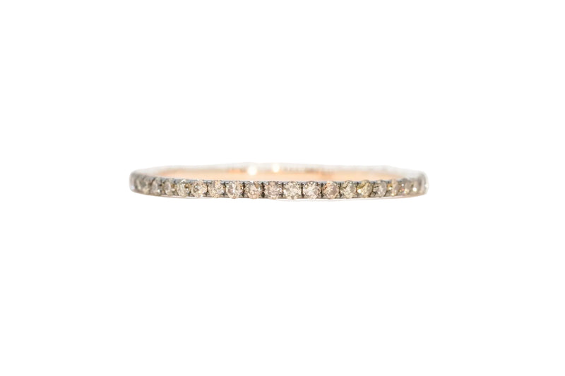 A stunning eternity band ring  set with champagne diamonds
