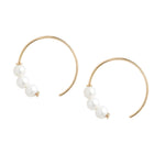 Poppy Finch -Triple Baby Pearl Circle Earrings on white background 