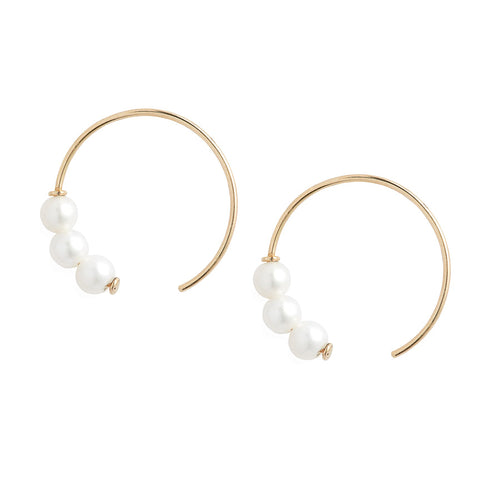 Poppy Finch -Triple Baby Pearl Circle Earrings on white background 