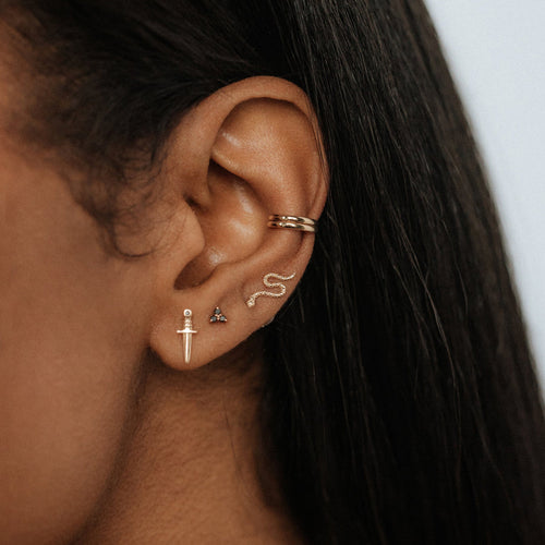Guardian Ear  Cuff shown on model wearing a yellow gold stack of earings 