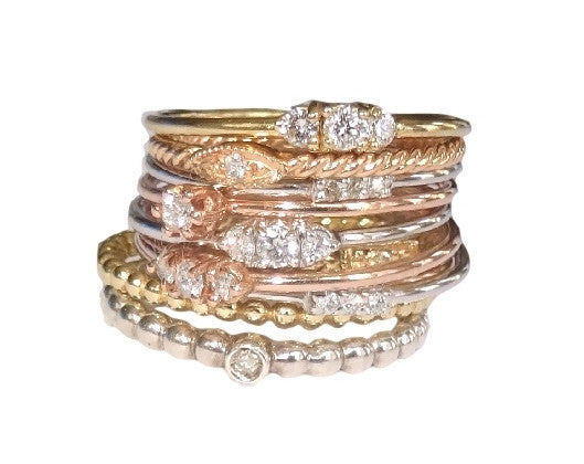 A stack of The Right Hand Gal 's 3 Tiny Wishes Ring-