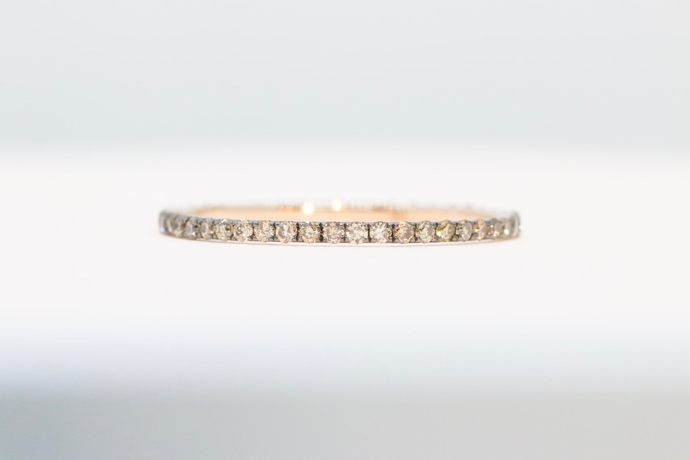 A stunning eternity band ring  set with champagne diamonds