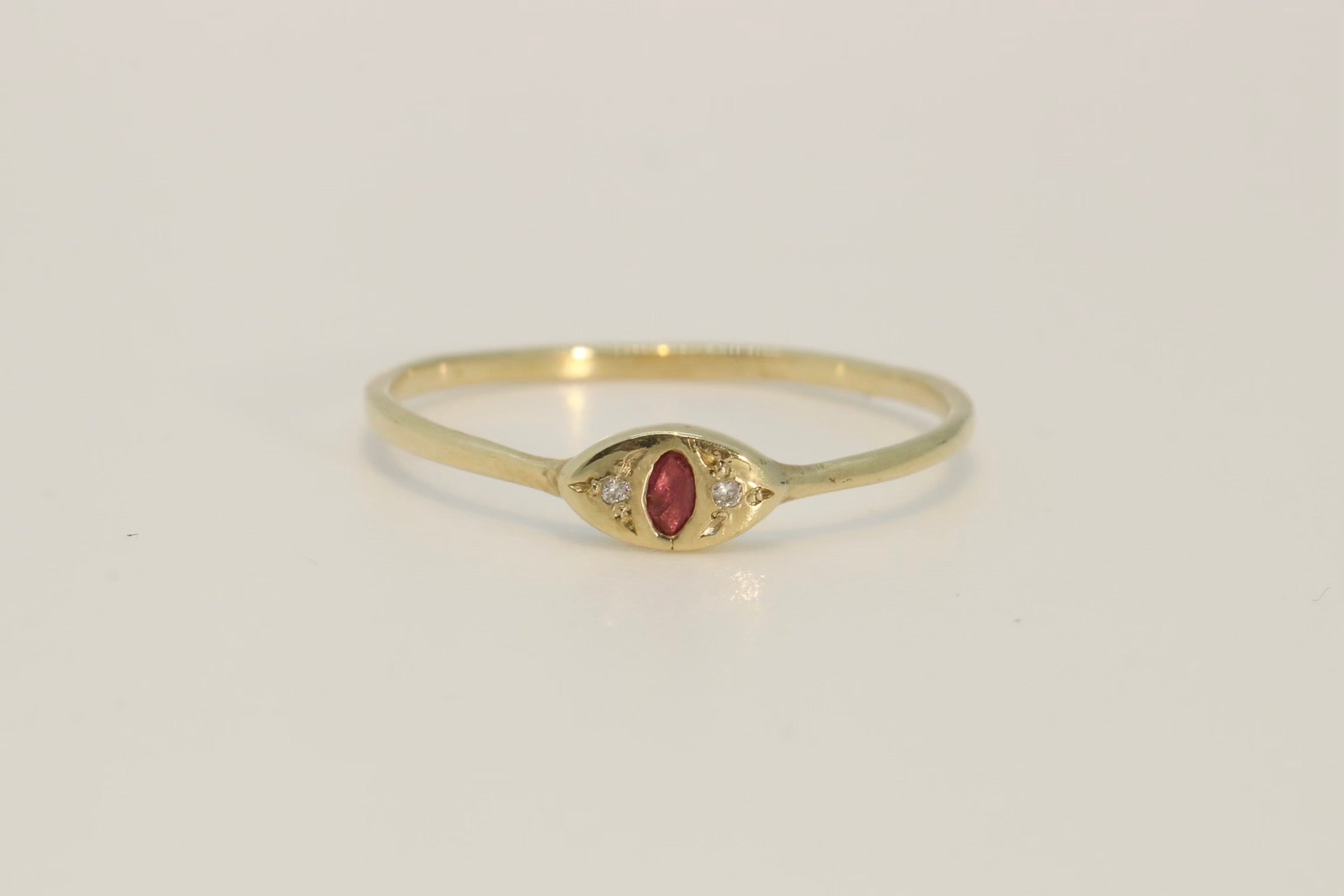 Evil eye Ruby and diamond ring  on a delicate gold band 