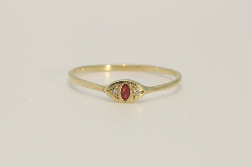 Evil eye Ruby and diamond ring  on a delicate gold band 