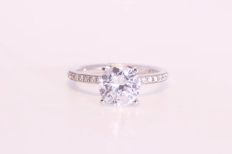 Classic solitaire with Pave diamond band