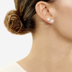 Model wearing 1- 2.5 CTW Diamond Stud earring and 1- 3 TCW Diamond Stud earring 