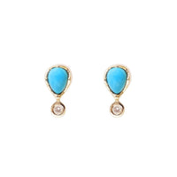 Pear Shaped Turquoise surrounded in yellow gold with a diamond drop at the bottom. Front view 