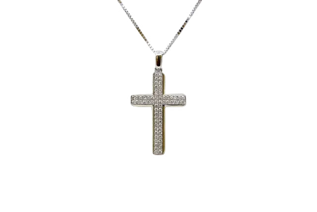 A white gold cross pendant necklace adorned with small clear stones, suspended from a silver chain against a plain white background.