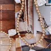 Pearl Heart Charm shown on silver Ball Bracelet worn by Model. 