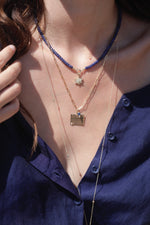 Zahava 16" Faceted Sapphire Beaded Necklace om Model, Also wearing Zahava Calendar Charm on Chain.  