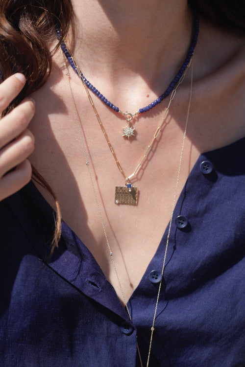 Zahava 16" Faceted Sapphire Beaded Necklace om Model, Also wearing Zahava Calendar Charm on Chain.  