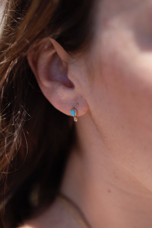 Model wearing Pear Shaped Turquoise Stud Earrings with Diamond Drop